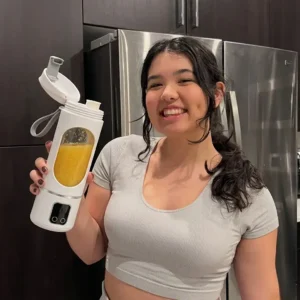Happy customer holding portable blender cup making fresh juice daily